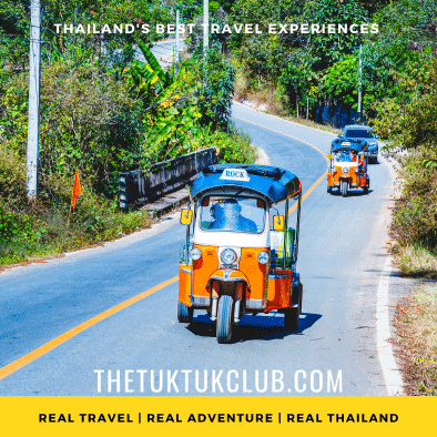 Two Tuk Tuks driving along a small country road on a Thailand adventure