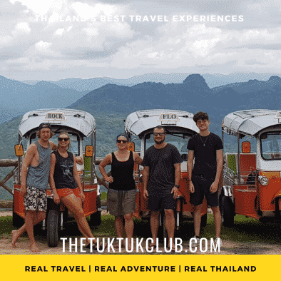 Five adventurous travellers standing in front of four Tuk Tuks with the mountains of Mae Hong Son in the background