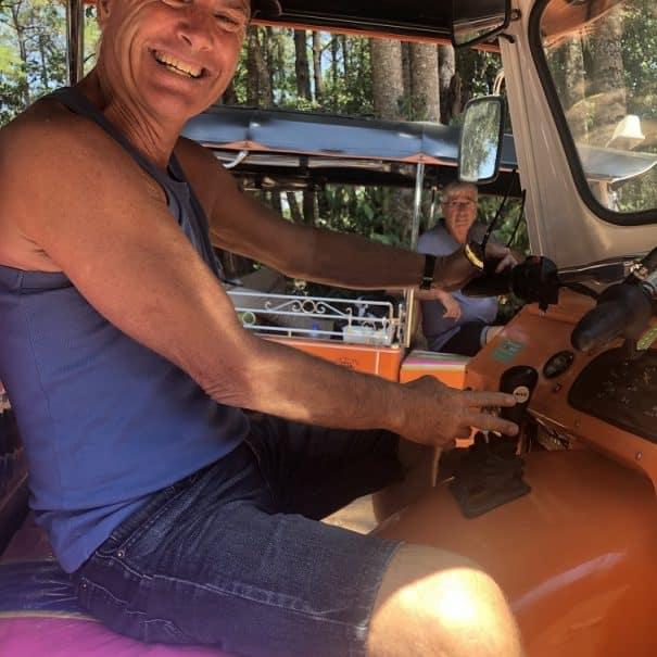 Why Tuk Tuks? 1 A big smile on the face of a man learning to drive a Tuk Tuk