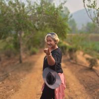 A Thai woman on a rural dirt road
